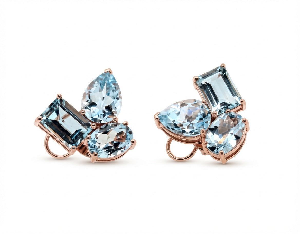 Rose gold gemstone stud earrings with blue topaz